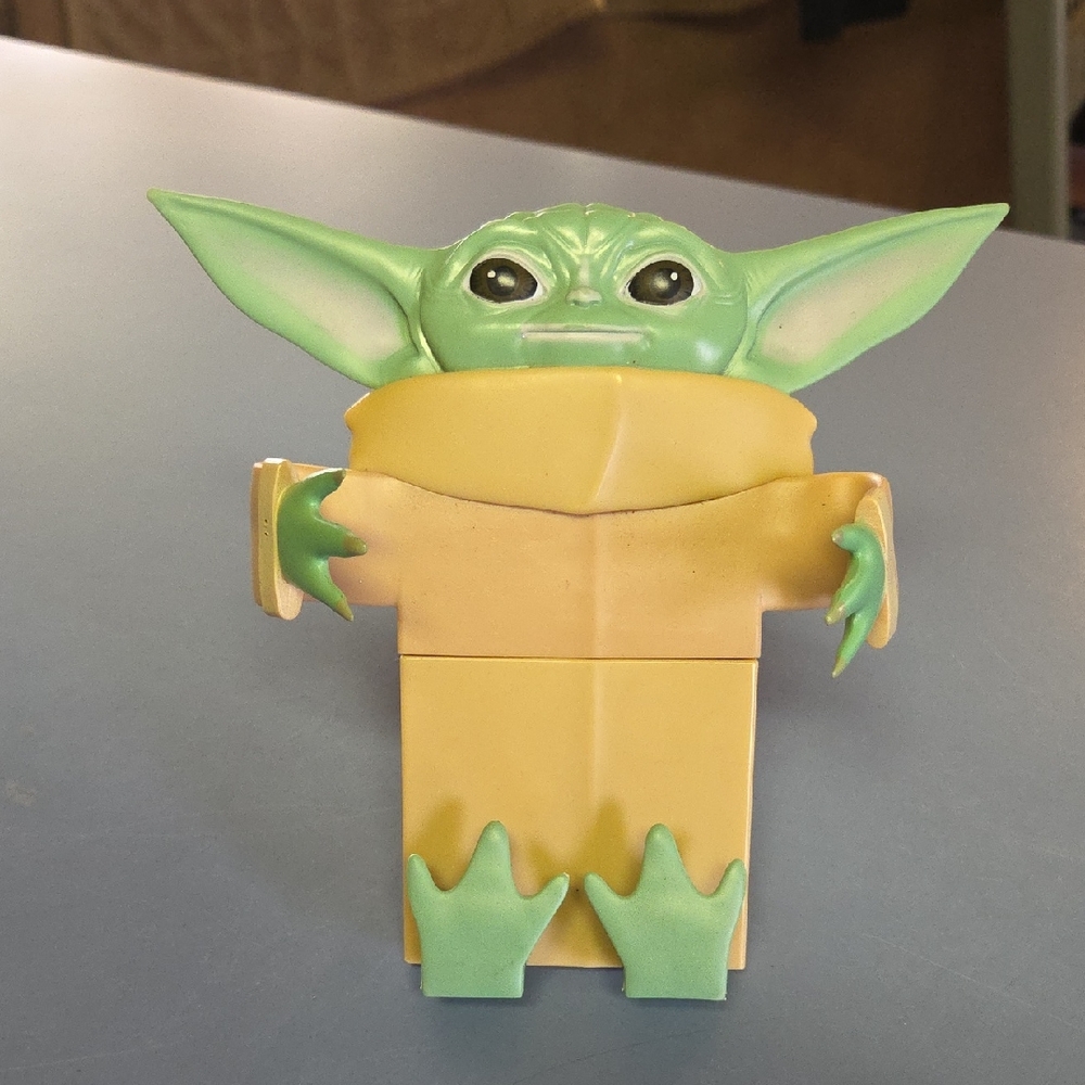 Green & Tan Novelty Phone Accessory Featuring Character Design